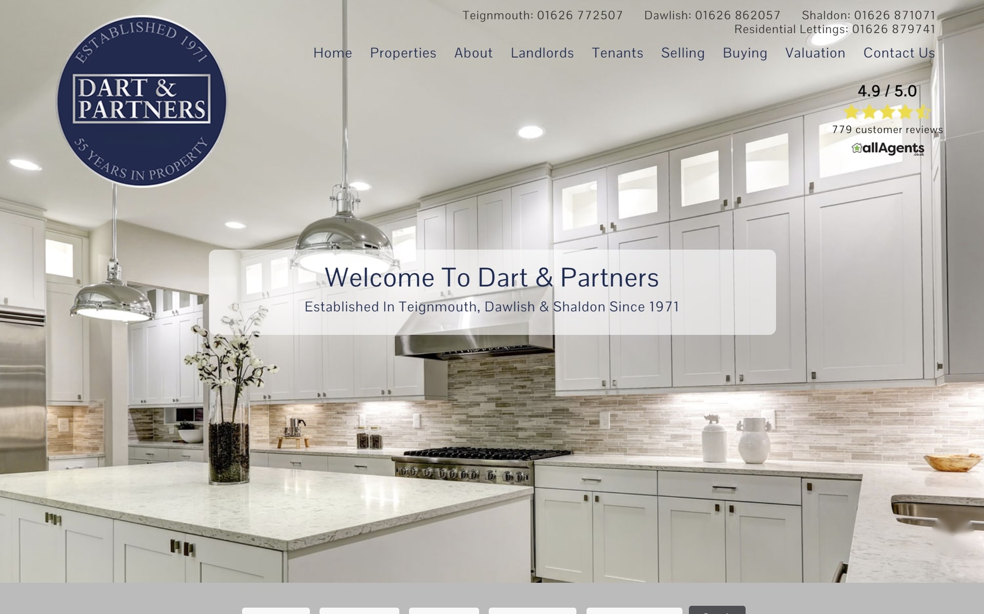 The previous Dart and Partners website, a white kitchen photograph with a centred welcome message